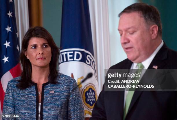 Secretary of State Mike Pompeo speaks as US Ambassador to the United Nation Nikki Haley looks on at the US Department of State in Washington DC on...