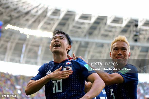 Shinji Kagawa of Japan celebrates scoring the opening goal with his team mate Yuto Nagatomo during the 2018 FIFA World Cup Russia group H match...