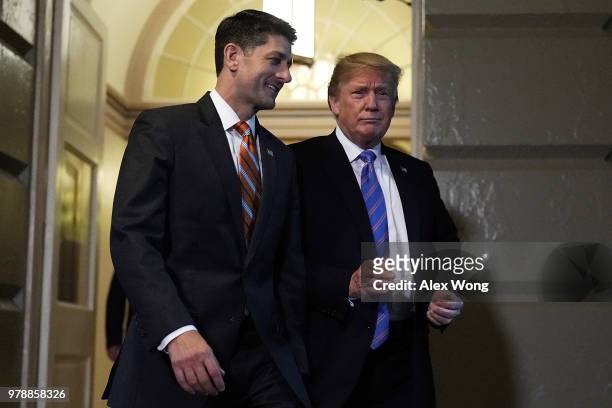Accompanied by Speaker of the House Rep. Paul Ryan , U.S. President Donald Trump arrives at a meeting with House Republicans at the U.S. Capitol June...