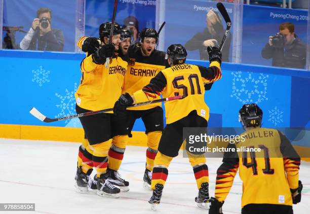 Dpatop - Germany's players celebrate scoring their 1st goal during the gold medal match between Germany and the Olympic Athletes from Russia on day...