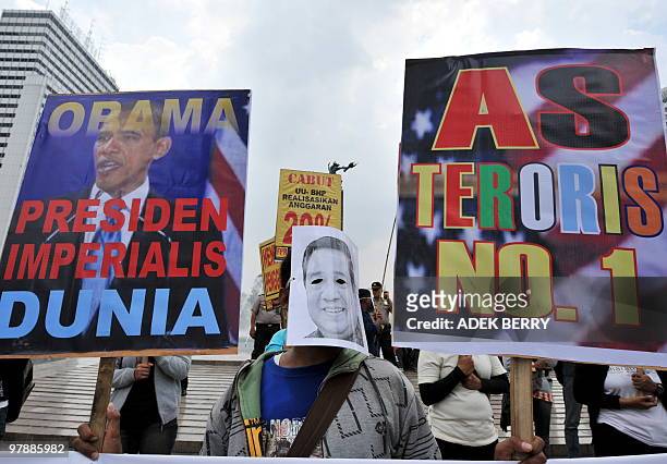 Indonesian labourers from 'Front Perjuangan Rakyat' protest against a potential visit by US President Barack Obama to Indonesia, in Jakarta on March...