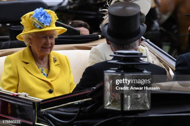 Queen Elizabeth ll arrives in an open carriage to attend the first day of Royal Ascot on June 19, 2018 in Ascot, England.