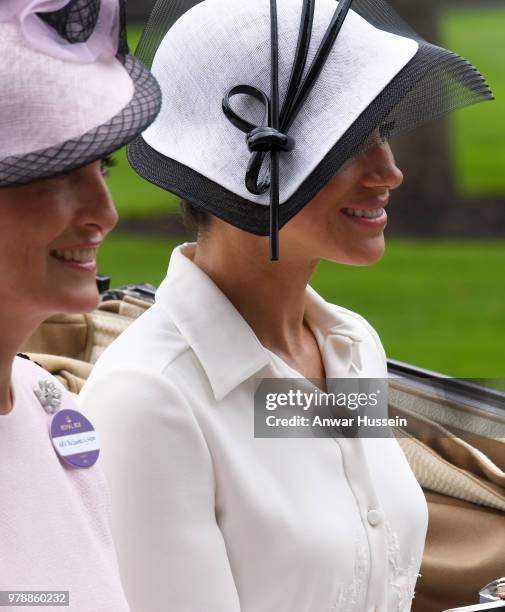 Meghan, Duchess of Sussex, making her Royal Ascot debut, and Sophie, Countess of Wessex arrive in an open carriage to attend the first day of Royal...