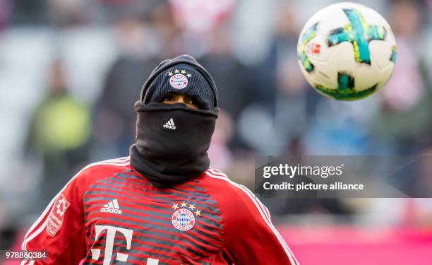 Febuary 2018, Germany, Munich: German Bundesliga soccer match between Bayern Munich and Hertha BSC, Allianz Arena. Bayern's Arturo Vidal protects...