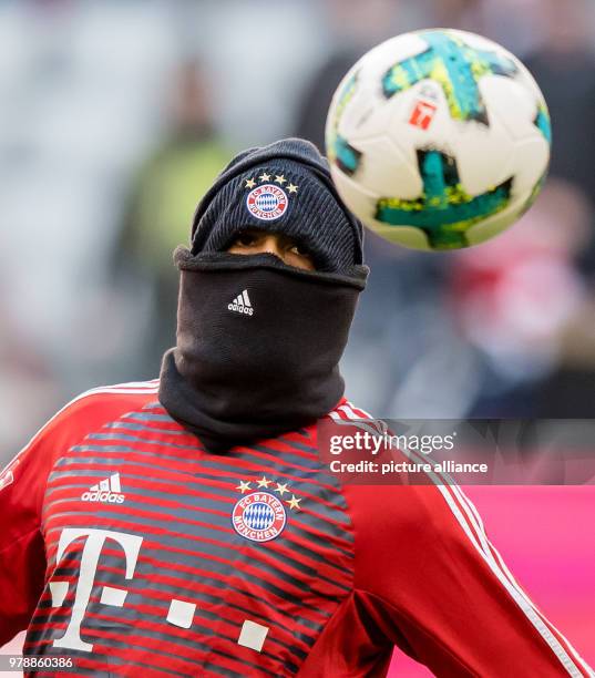 Febuary 2018, Germany, Munich: German Bundesliga soccer match between Bayern Munich and Hertha BSC, Allianz Arena. Bayern's Arturo Vidal protects...