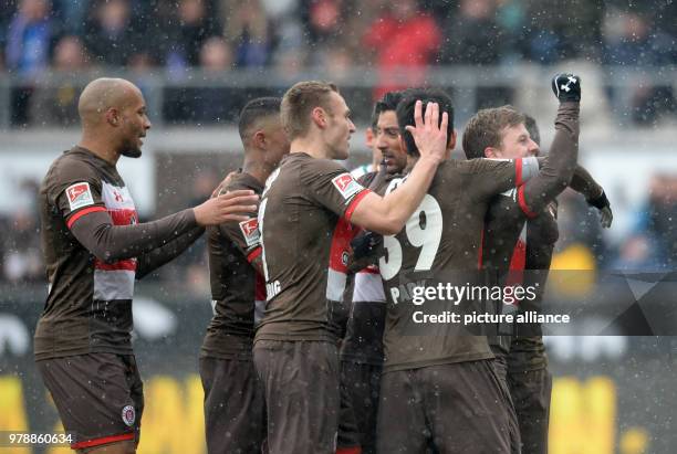 February 2018, Germany, Hamburg, Soccer, 2. Bundesliga, FC St.Pauli vs. Holstein Kiel, Millerntor Stadium: Hamburg's players cheer after Christopher...