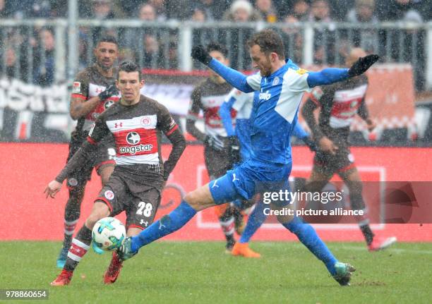 February 2018, Germany, Hamburg, Soccer, 2. Bundesliga, FC St.Pauli vs. Holstein Kiel, Millerntor Stadium: Hamburg's Waldemar Sobota and Kiel's...