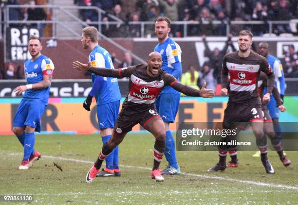 February 2018, Germany, Hamburg, Soccer, 2. Bundesliga, FC St.Pauli vs. Holstein Kiel, Millerntor Stadium: Hamburg's Christopher Avevor cheers over...