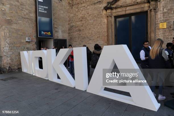 February 2018, Spain, Barcelona: The letters of the brand "Nokia" can be seen during the mobile communications fair "Mobile World Congress" - Nokia...