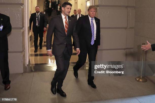 President Donald Trump, center right, and U.S. House Speaker Paul Ryan, a Republican from Wisconsin, center left, walk to a House Republican...