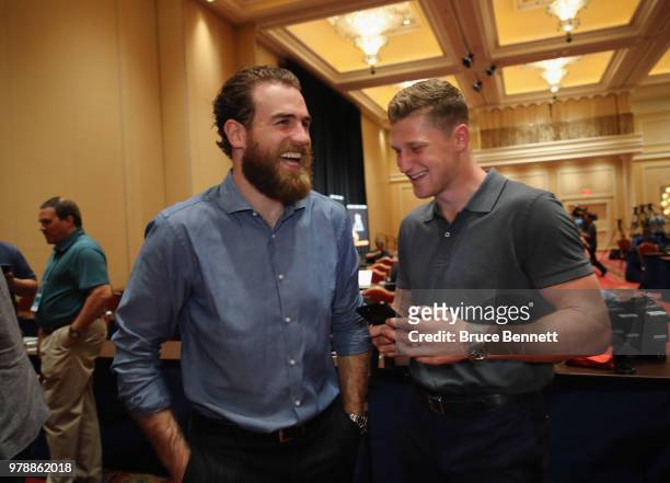Ryan O'Reilly and Nathan MacKinnon share a laugh during the 2018 NHL Awards nominee media availability at the Encore Las Vegas on June 19, 2018 in...