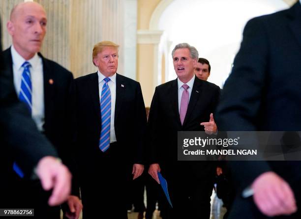 President Donald Trump walks next to US House Majority Leader Kevin McCarthy after a meeting at the US Capitol with the House Republican Conference...