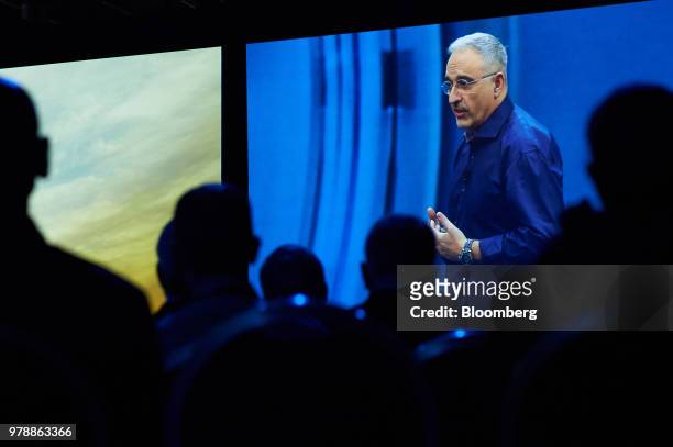 An image of Antonio Neri, president and chief executive officer of Hewitt Packerd Enterprise , is displayed on a screen as he speaks during the HPE...