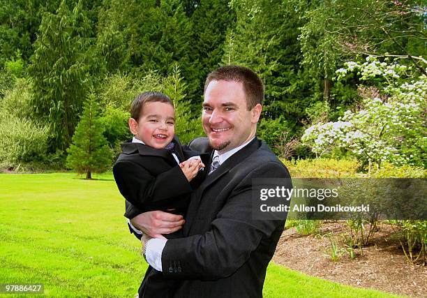father and son all dressed up in the park - babies and smoking stock-fotos und bilder