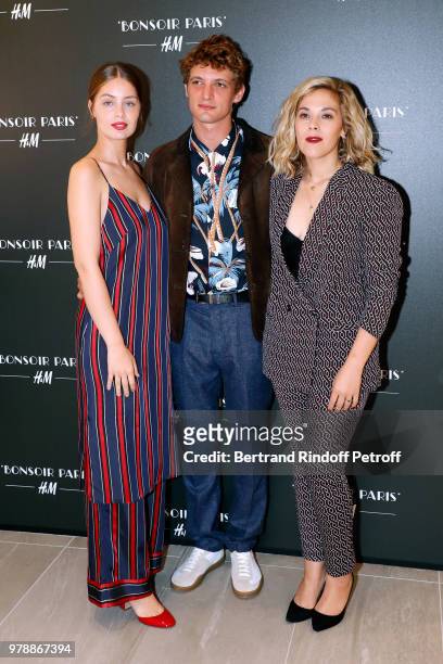 Niels Schneider standng between Marie-Ange Casta and Alysson Paradis attend the H&M Flaship Opening Party as part of Paris Fashion Week on June 19,...