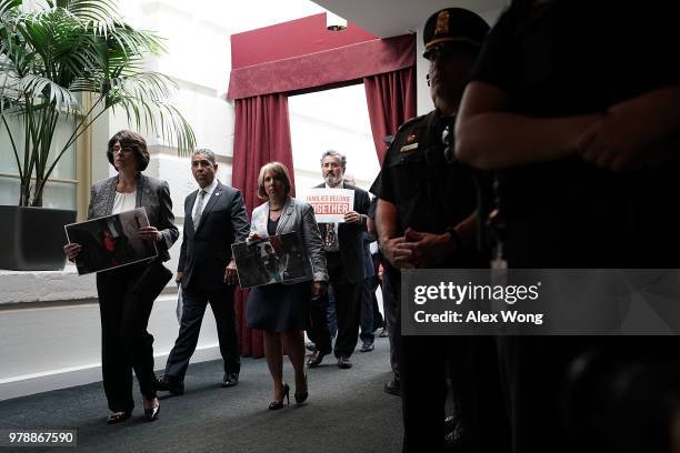 Rep. Lucille Roybal-Allard , Rep. Adriano Espaillat , Rep. Michelle Lujan Grisham , Rep. Juan Vargas hold signs as they stage a protest outside a...