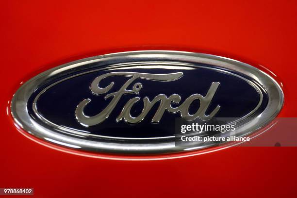 February 2018, Germany, Cologne: The logo of "Ford" can be seen on the hood of a Ford Fiesta. Photo: Oliver Berg/dpa