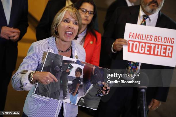 Representative Michelle Lujan Grisham, a Democrat from New Mexico, demonstrates during a House Republican conference meeting on immigration...