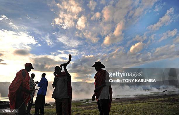 Endorois elders blow an animal horn to call blessings on themselves on March 20, 2010 on the shores of Lake Bogoria, approximately 300 kilometres...