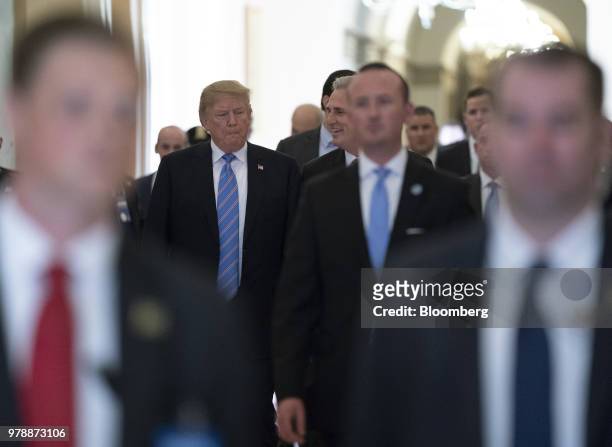 President Donald Trump, center left, walks with House Majority Leader Kevin McCarthy, a Republican from California, center right, after a House...
