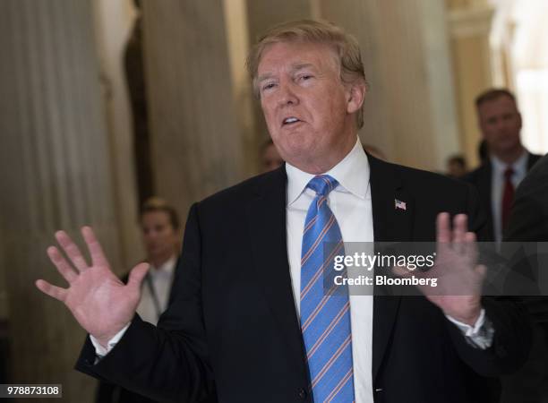 President Donald Trump speaks to members of the media following a House Republican conference meeting on immigration legislation at the U.S. Capitol...