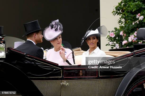 Meghan, Duchess of Sussex, Sophie, Countess of Wessex and Prince Harry, Duke of Sussex arrive in an open carriage to attend the first day of Royal...