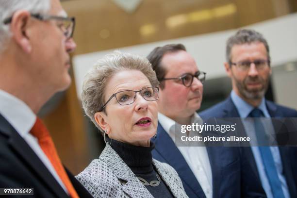 February 2018, Germany, Bonn: Barbara Bosch , mayor of Reutlingen, Thomas Kufen , Omayor of Essen, and Thomas Sprissler , mayor of Herrenberg, answer...