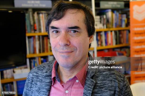 January 2018, Romania, Bukarest: The writer Mircea Cartarescu in front of book shelves at the book store Humanitas. Photo: Birgit...