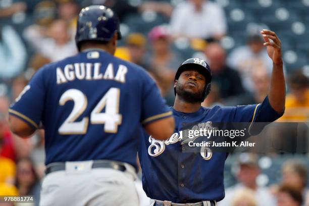 Lorenzo Cain of the Milwaukee Brewers celebrates with Jesus Aguilar of the Milwaukee Brewers after hitting a two run home run in the first inning...