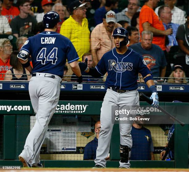 Cron of the Tampa Bay Rays receives congratulations from Carlos Gomez after hitting a home run in the second inning against the Houston Astros at...