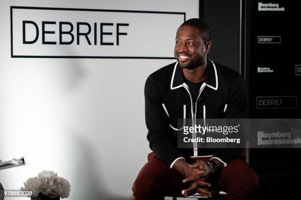 Dwyane Wade, a professional basketball player with the National Basketball Association's Miami Heat, smiles during a Bloomberg Businessweek Debrief...