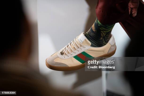 Dwyane Wade, a professional basketball player with the National Basketball Association's Miami Heat, wears Gucci Group NV sneakers during a Bloomberg...