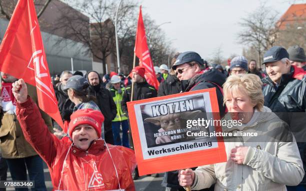 Employees of the Ledvance company, threatened by shutting down, take part in a rally of IG Metall outside the Siemes Dynamo plant in Berlin, Germany,...