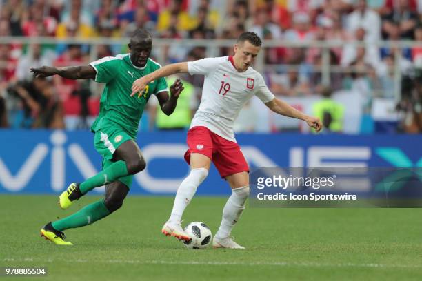 Midfielder Cheikh Ndoye of Senegal and midfiqlder Piotr Zielinski of Poland during a Group H 2018 FIFA World Cup match between Poland and Senegal on...