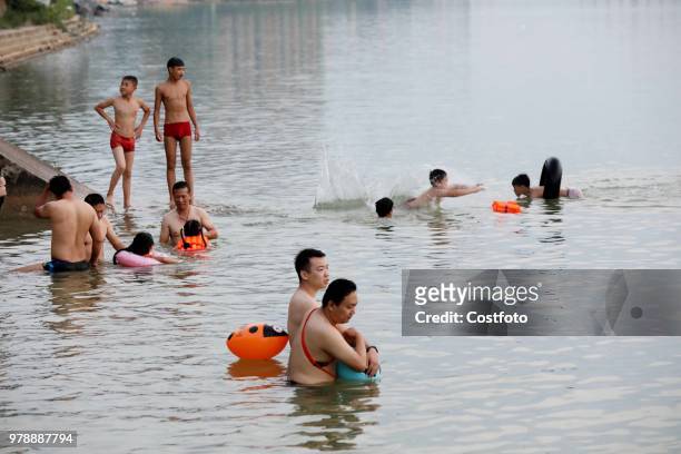 On June 19 residents in the upper reaches of the pearl river, rongjiang county, liuzhou city, guangxi province, China,played in the middle of the...