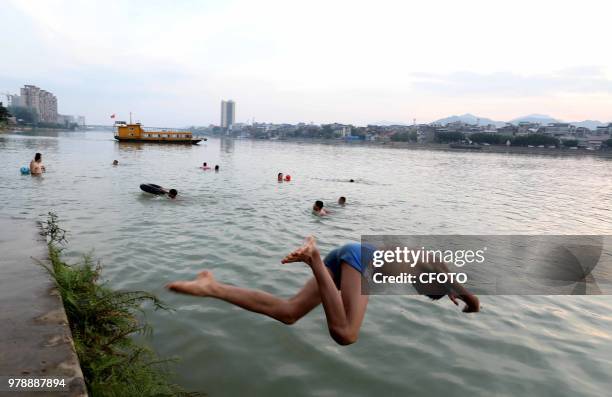 On June 19 residents in the upper reaches of the pearl river, rongjiang county, liuzhou city, guangxi province, China,played in the middle of the...