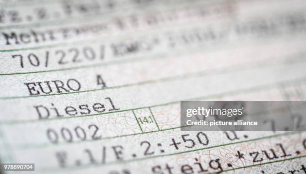 Note on the "Euro 4" norm and "Diesel" seen on a vehicle registration in Berlin, Germany, 28 February 2018. Photo: Kay Nietfeld/dpa