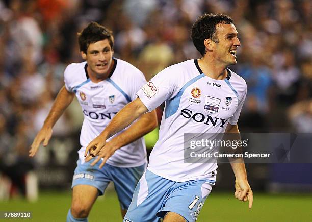 Mark Bridge of Sydney FC celebrates scoring a goal during the A-League Grand Final match between the Melbourne Victory and Sydney FC at Etihad...