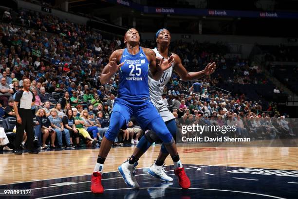 Glory Johnson of the Dallas Wings boxes out Sylvia Fowles of the Minnesota Lynx on June 19, 2018 at Target Center in Minneapolis, Minnesota. NOTE TO...