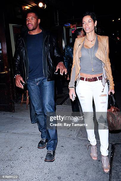 Actor and television personality Michael Strahan and Nicole Murphy enter Philippe Chow on March 19, 2010 in New York City.