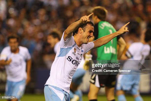 Mark Bridge of Sydney FC celebrates scoring a goal during the A-League Grand Final match between the Melbourne Victory and Sydney FC at Etihad...