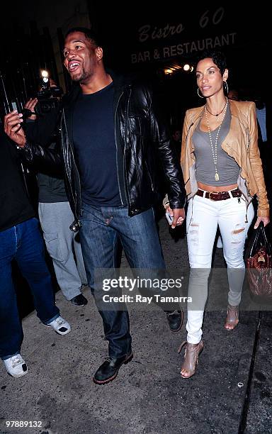 Actor and television personality Michael Strahan and Nicole Murphy enter Philippe Chow on March 19, 2010 in New York City.