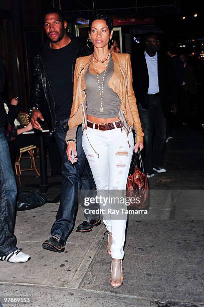 Actor and television personality Michael Strahan and Nicole Murphy enter Philippe Chow on March 19, 2010 in New York City.