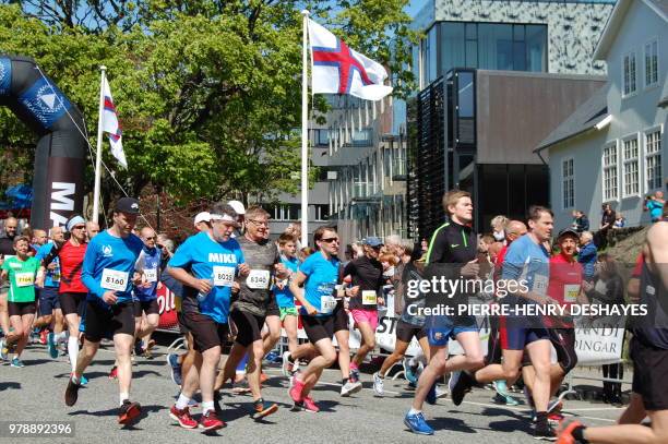 Competitors run during the Atlantic Airways Tórshavn Marathon on June 3, 2018 in the city of Torshavn, on the Streymoy Island, the largest of Faroe...