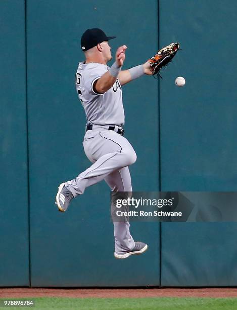 Adam Engel of the Chicago White Sox cannot make a catch on a double by Michael Brantley of the Cleveland Indians during the seventh inning at...