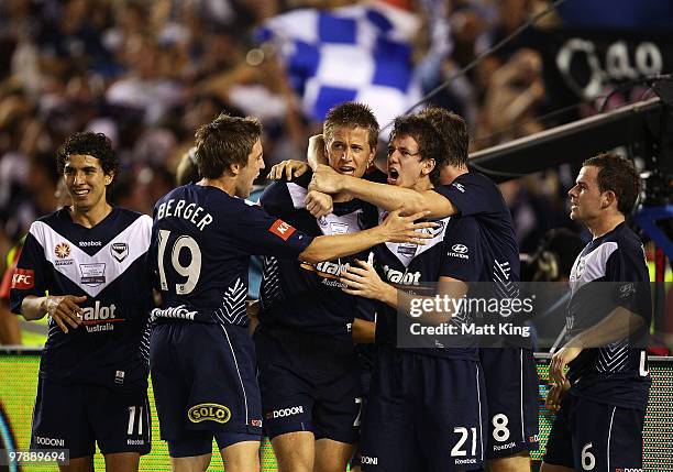 Adrian Leijer of the Victory celebrates with team mates after scoring a second half goal during the A-League Grand Final match between the Melbourne...
