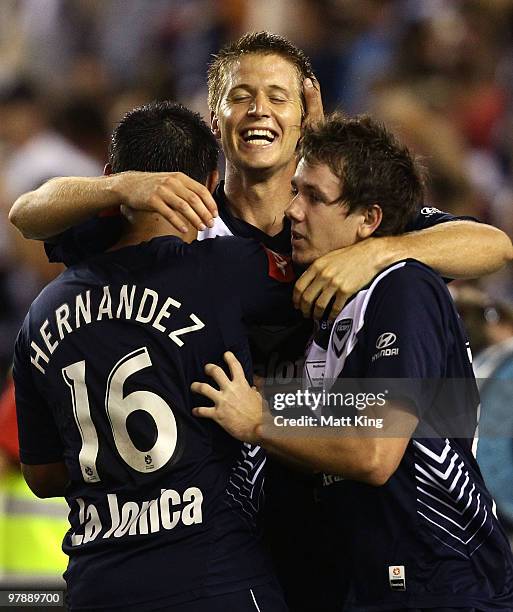 Adrian Leijer of the Victory celebrates with team mates after scoring a second half goal during the A-League Grand Final match between the Melbourne...