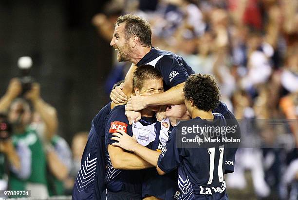 Grant Gruber of Melbourne celebrates with team mate Adrian Leijer after Leijer scored during the A-League Grand Final match between the Melbourne...