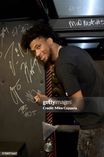 Marvin Bagley III adds his signature to the JBL Dare to Listen Bus before heading into the JBL x MB3 Draft Party, an exclusive event to celebrate his...