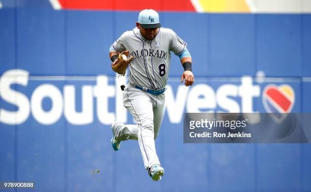 Gerardo Parra of the Colorado Rockies catches a fly ball off the bat of Nomar Mazara of the Texas Ranger to end the first inning at Globe Life Park...